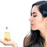 woman with argan oil bottle